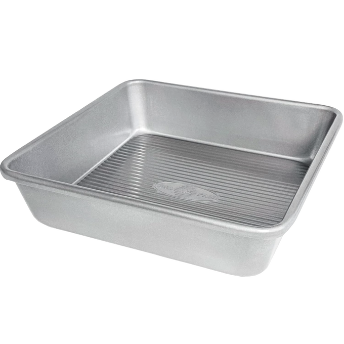 Heavy gauge aluminized steel square cake pan with seamless design and nonstick silicone coating, ideal for baking cakes and brownies, part of Kitchen & Food and USA Made collections.