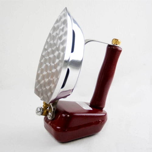 Butane iron with cast aluminum sole plate and ergonomic wooden handle, designed for reliable use without electricity, featured in Home & Decor, Laundry Supplies, USA Made, and Best Sellers collections.