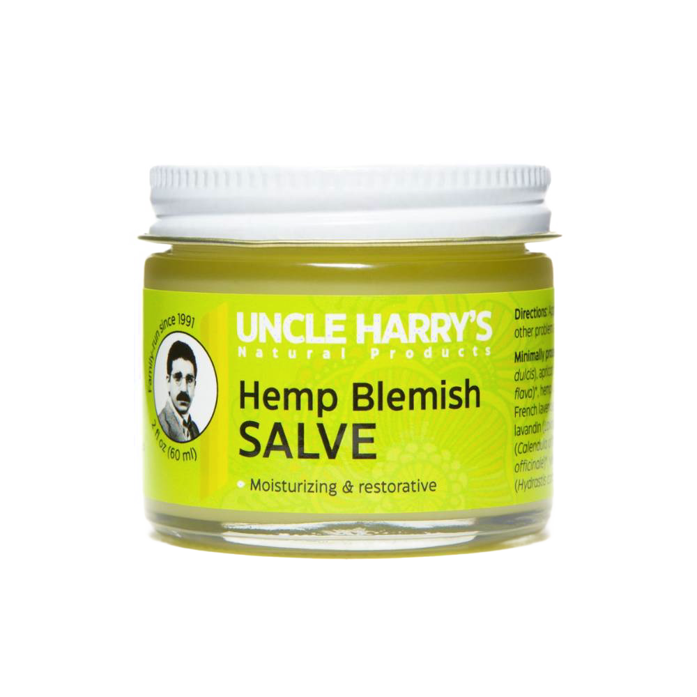 Clear glass jar with metal lid containing Uncle Harry's Hemp Blemish Salve, a handcrafted moisturizing balm made in USA, part of Health & Wellness, Balms, Creams and Lotions, and Best Sellers collections.