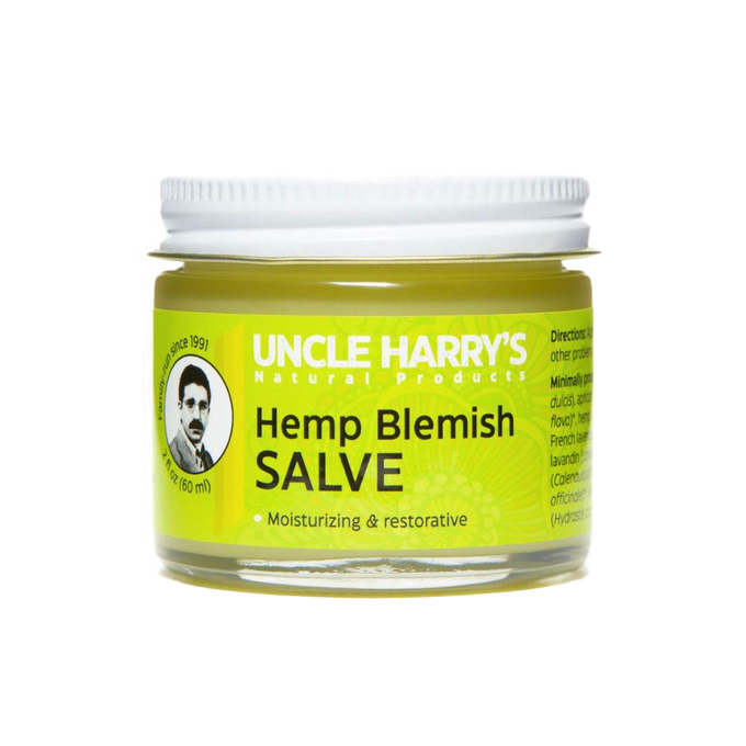 Clear glass jar with metal lid containing Uncle Harry's Hemp Blemish Salve, a handcrafted moisturizing balm made in USA, part of Health & Wellness, Balms, Creams and Lotions, and Best Sellers collections.