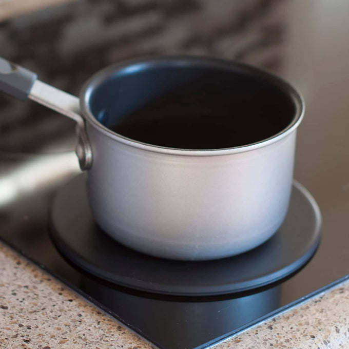 Handcrafted induction heat diffuser plate made in USA, providing an even flat cooking surface when placed over gas or electric stove burners, ideal for Kitchen & Food and Kitchen Gadgets collections.