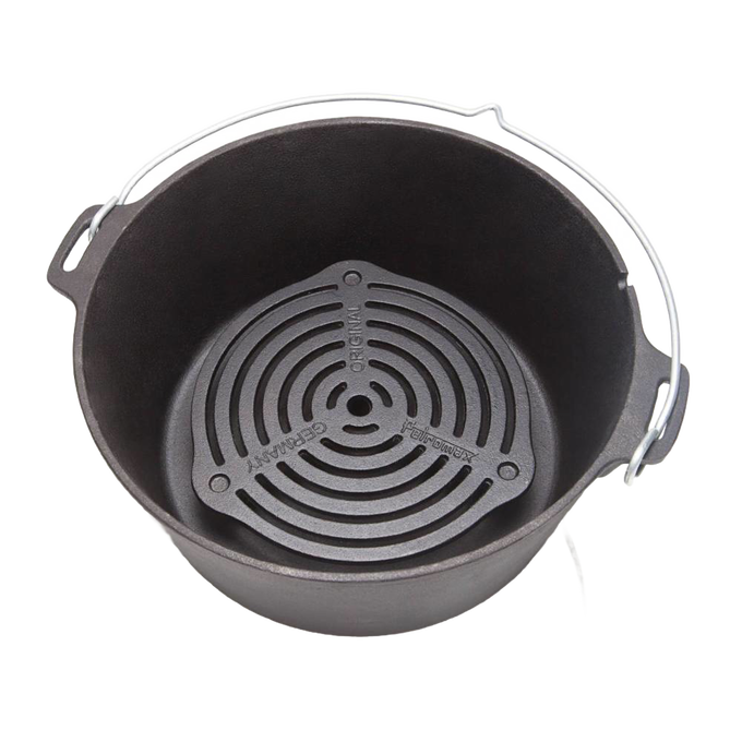 Cast iron stack grate inside a Dutch oven with sturdy metal handle, designed for even heat distribution, suitable for Farm, Garden & Tool, Camping, Kitchen & Food, and Cookware collections.