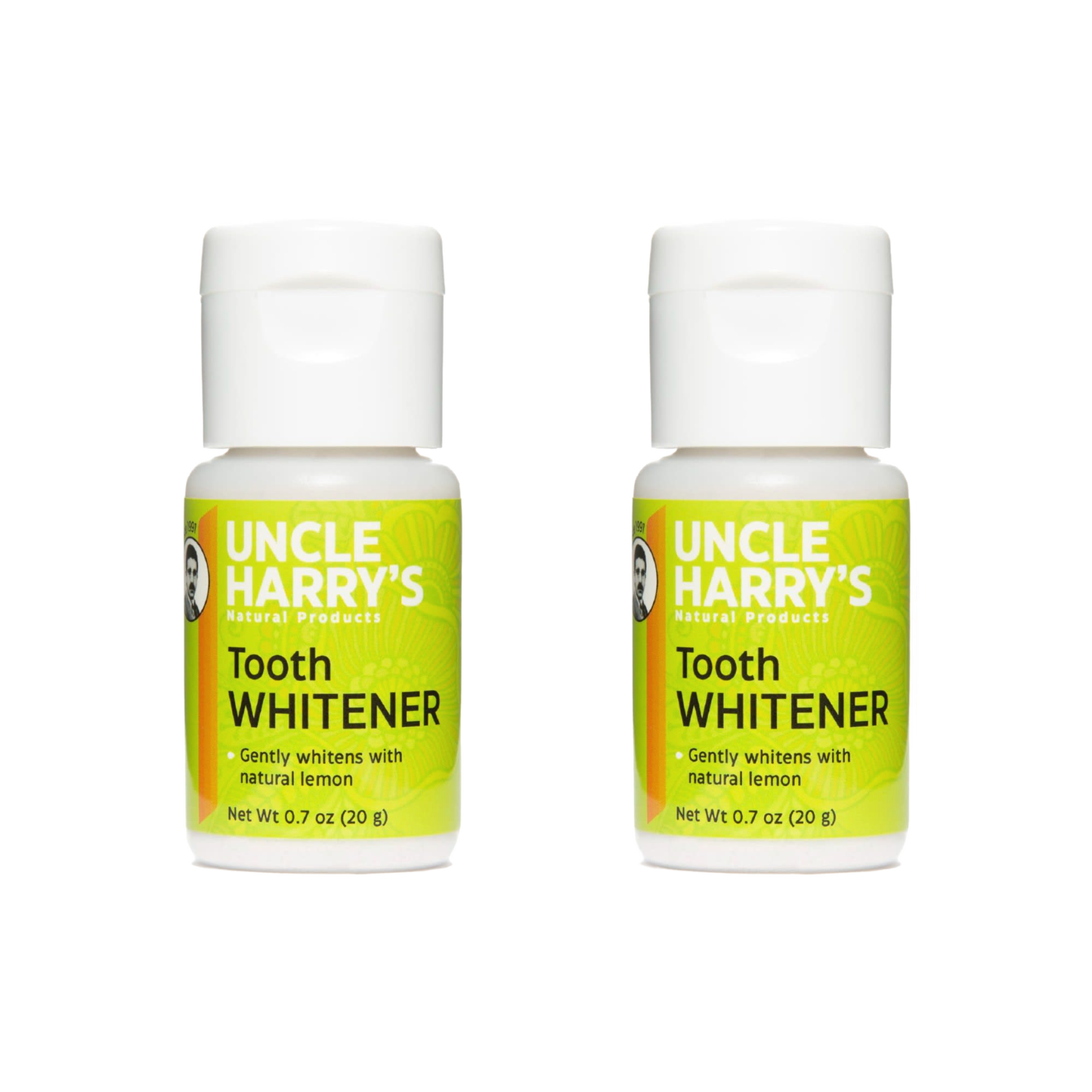 Two small bottles of handcrafted all-natural tooth whitener powder with bright green labels, featuring lemon as a key ingredient, ideal for health, grooming, and USA made collections.