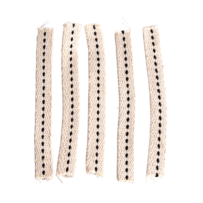 Handcrafted cotton flat wicks with a distinctive black stitched center, designed for clean and efficient fuel flow in oil lamps, suitable for emergency supplies and garden lighting.