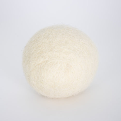 Single natural cream-colored wool dryer ball, handcrafted in the USA for repeated use, featured in Home & Decor and Laundry Supplies collections.