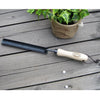 Handcrafted Dutch transplanter with an ash wood handle and extra-long narrow blade, designed for digging deep roots, ideal for Farm, Garden & Tool, Digging and Cultivating collections.