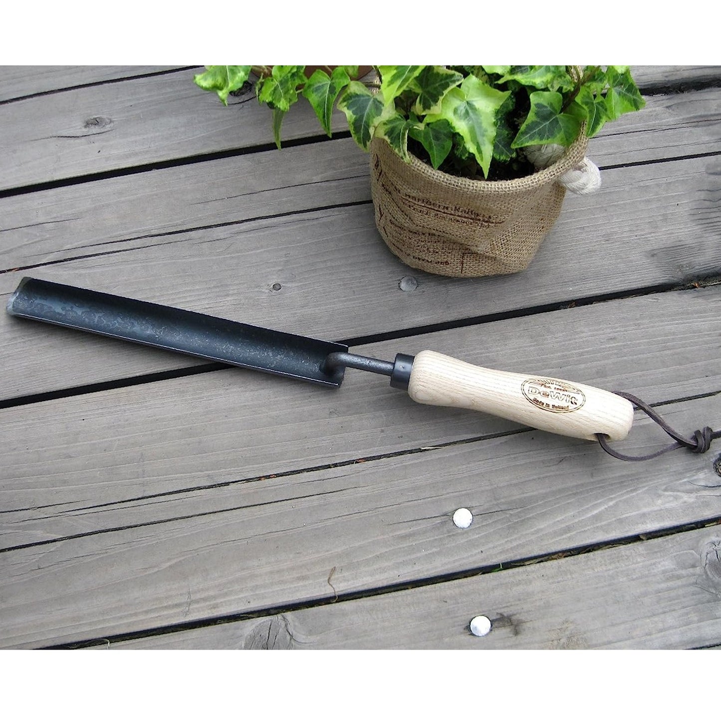 Handcrafted Dutch transplanter with an ash wood handle and extra-long narrow blade, designed for digging deep roots, ideal for Farm, Garden & Tool, Digging and Cultivating collections.