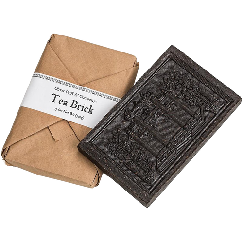 Handcrafted black tea brick with intricate embossed design, wrapped in rustic brown paper packaging, ideal for Kitchen & Food, Brewing Coffee and Tea, Beverages, and Best Sellers collections.