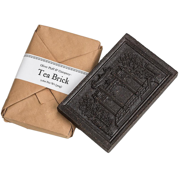 Handcrafted black tea brick with intricate embossed design, wrapped in rustic brown paper packaging, ideal for Kitchen & Food, Brewing Coffee and Tea, Beverages, and Best Sellers collections.