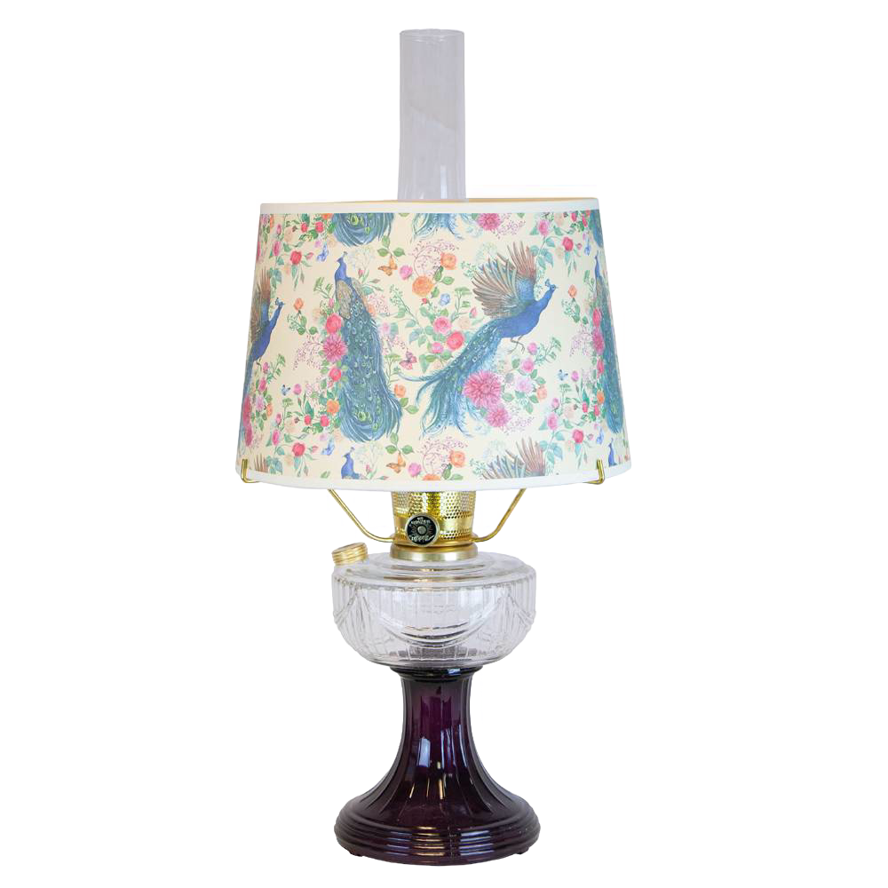 Handcrafted oil lamp featuring a clear glass bowl over an amethyst pedestal base with a floral and peacock patterned shade, perfect for lamps & lighting and table lamps collections.