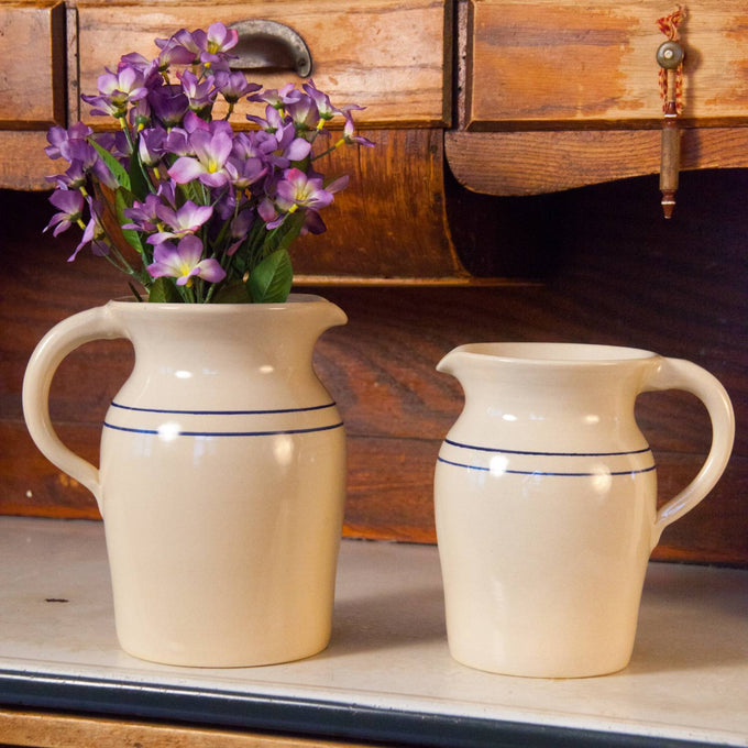Pair of handmade glazed stoneware pitchers in cream with simple blue stripes, lead-free and made in USA, suitable for serving or as decorative vases, ideal for Kitchen & Food and Dinnerware collections.