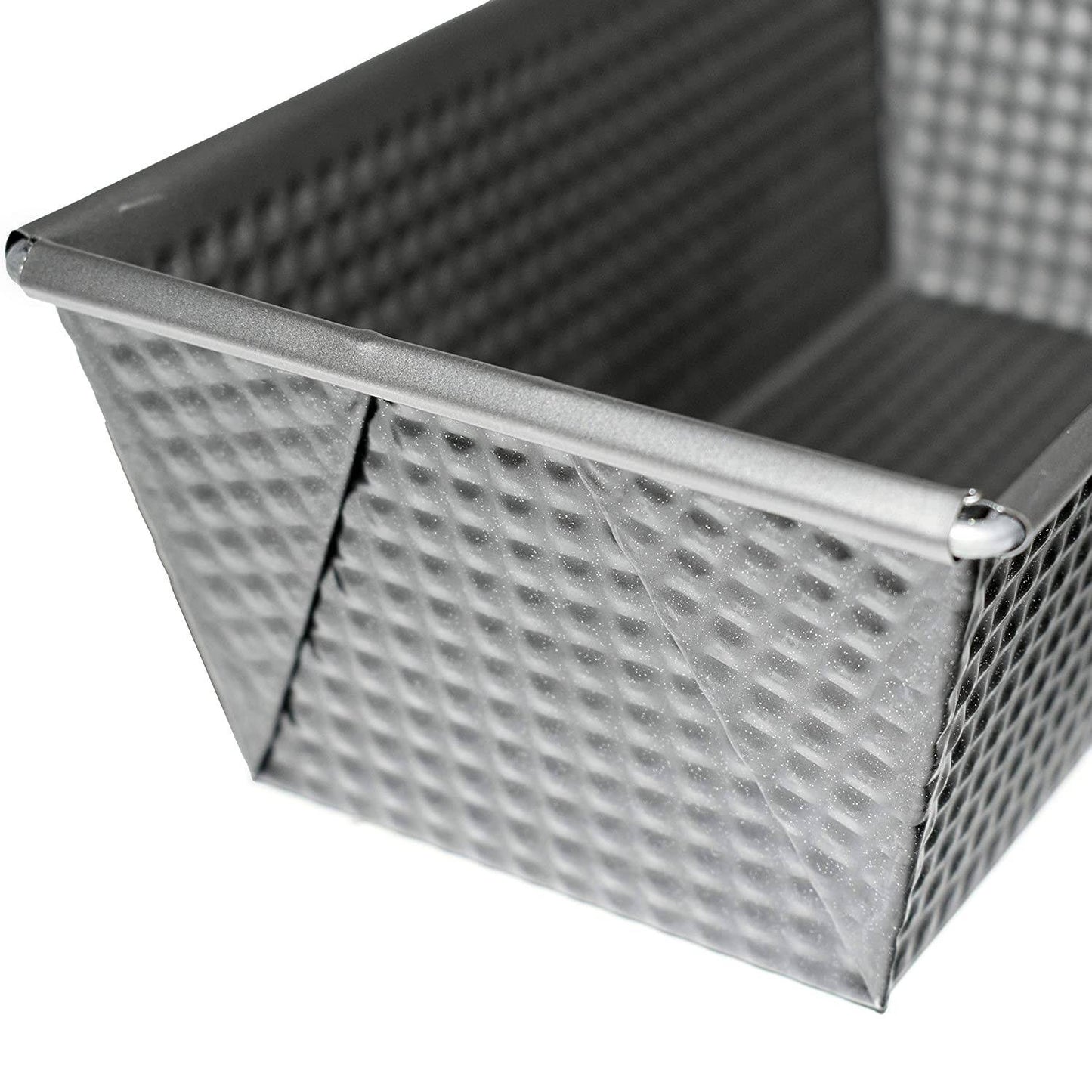 Close-up of a heavy gauge steel bread loaf pan with a textured surface and tapered sides, designed for nonstick baking in Kitchen & Food, Cookware, Baking Supplies, and Bread Making collections.