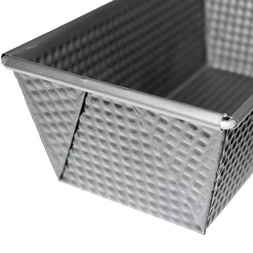 Close-up of a heavy gauge steel bread loaf pan with a textured surface and tapered sides, designed for nonstick baking in Kitchen & Food, Cookware, Baking Supplies, and Bread Making collections.