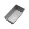Nonstick aluminized steel bread loaf pan with corrugated surface for even baking, handcrafted in the USA, part of Kitchen & Food, Cookware, and Bread Making Supplies collections.