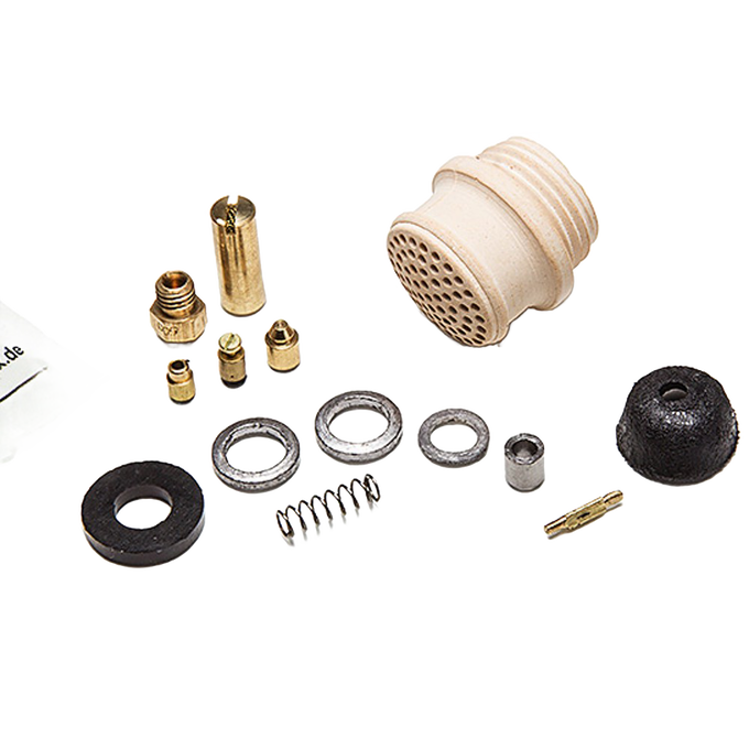 Set of various brass and ceramic replacement parts including a ceramic burner head, seals, springs, and fittings, crafted for lamps and lighting maintenance, suitable for lamps, parts and accessories collections.