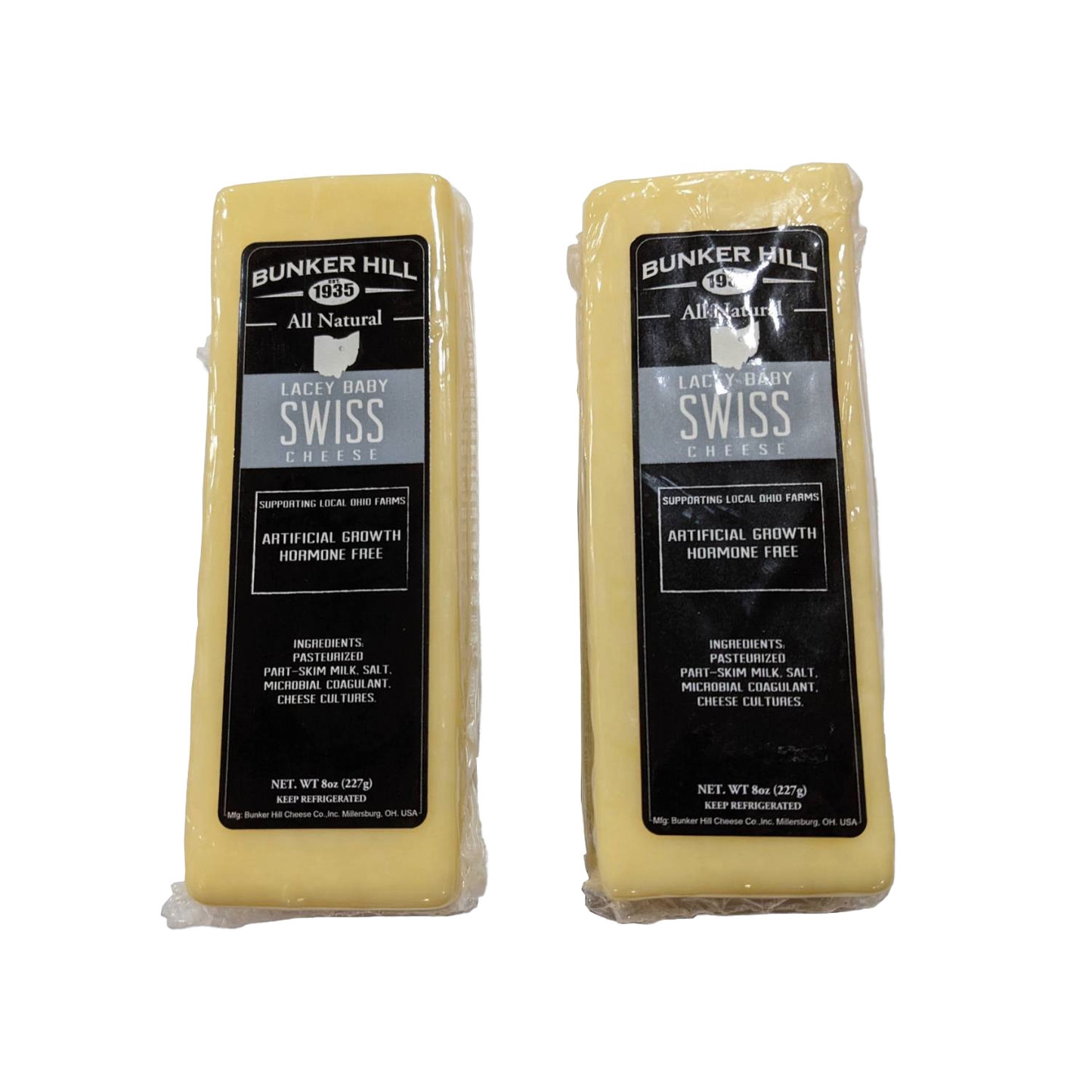 Two blocks of handcrafted all-natural Lacey Baby Swiss cheese with black and silver labels, made in the USA, perfect for Kitchen & Food, Food, Meats, and Best Sellers collections.