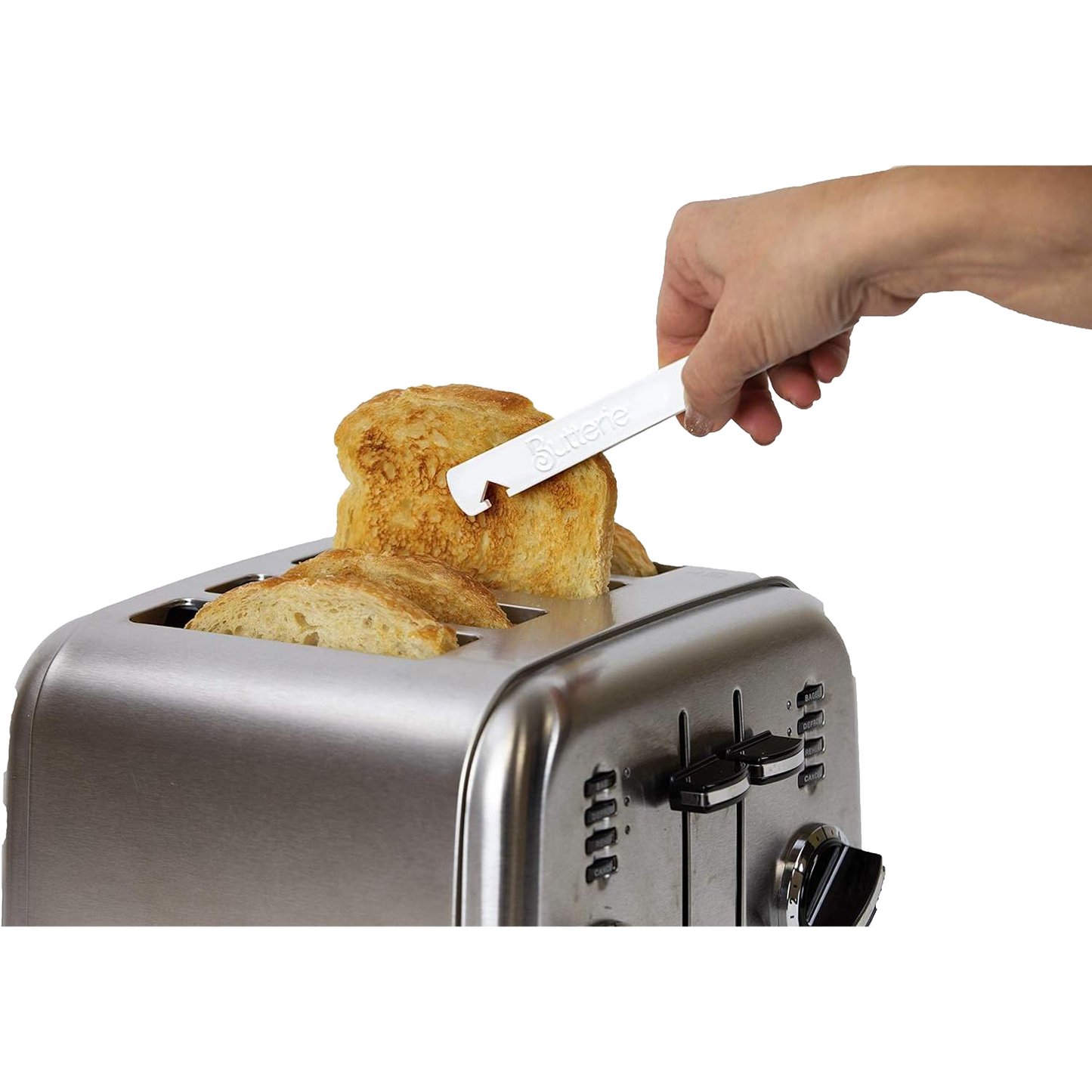 Hand using white Butterie toaster tongs with serrated teeth to safely remove toasted bread from stainless steel toaster, part of Kitchen Gadgets and Kitchen Accessories collections.