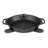Cast iron skillet resting on a pair of black silicone trivets with textured grips, designed for safe handling of hot cookware in kitchen, camping, and cookware collections.