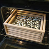Handcrafted solid oak food drying rack with fiberglass screens filled with sliced onions and garlic, placed in an oven for food preservation, USA made, featured in Kitchen & Food and Drying collections.