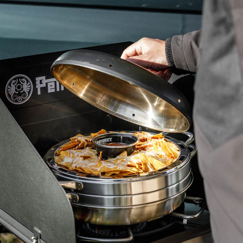 Handcrafted stainless steel camping oven with a hinged lid lifted to reveal baked casserole inside, ideal for outdoor use in Farm, Garden & Tool, Camping, and Best Sellers collections.