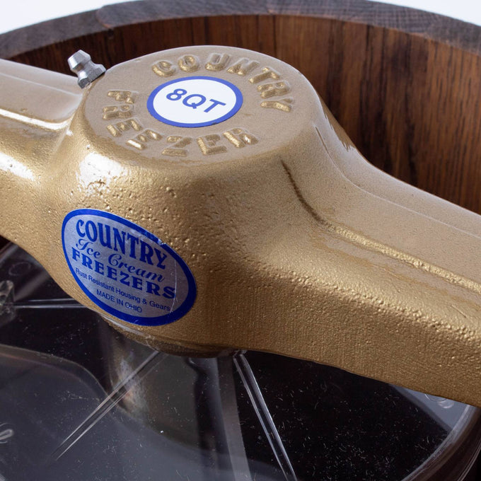 Close-up of a handcrafted wooden ice cream freezer showing detailed brass crank arm with "Country Freezer" label, highlighting rugged construction in Kitchen & Food and Specialty Equipment collections.