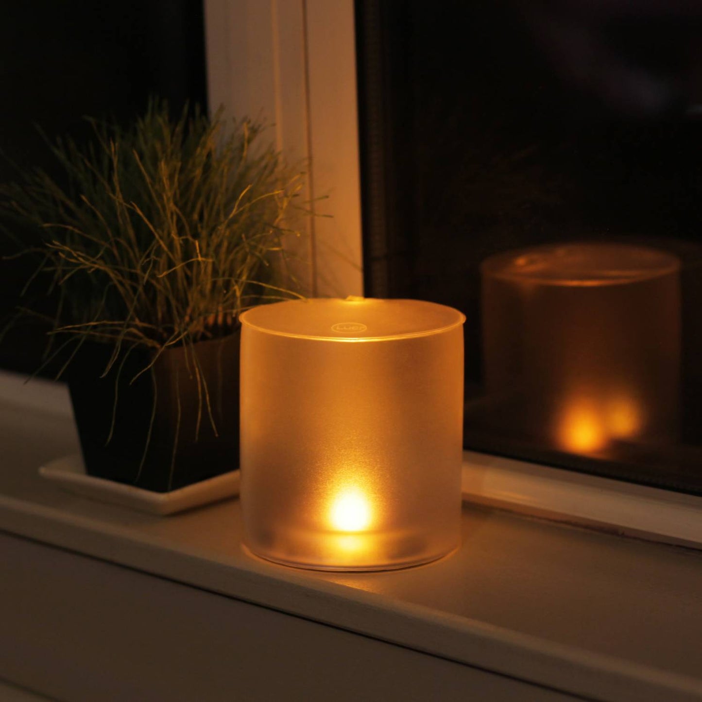 Soft glowing portable solar LED candle with a warm flicker effect, inflatable and waterproof for use in camping, emergency supplies, and lamps & lighting collections.
