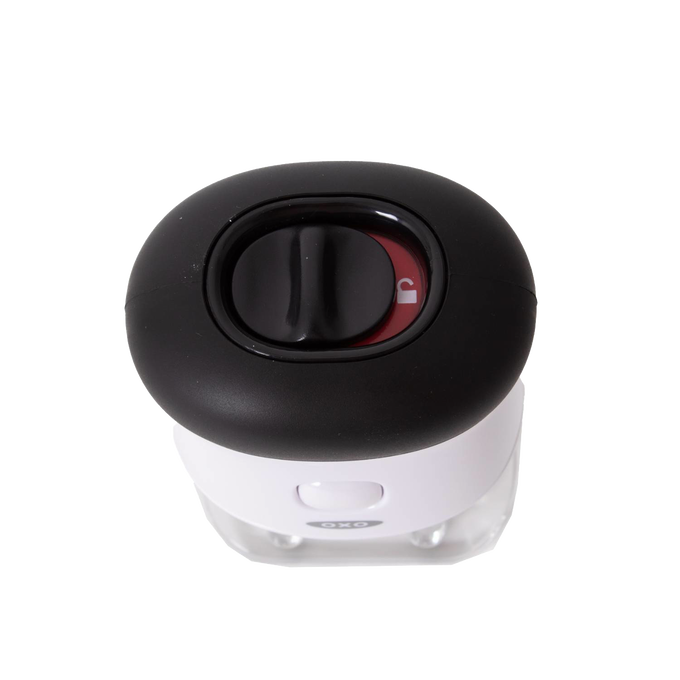 Top view of OXO bladed meat tenderizer showing black safety lock dial on white body with non-slip grip, a Kitchen & Food, Specialty Equipment, Butchering Supplies, and Best Sellers item.