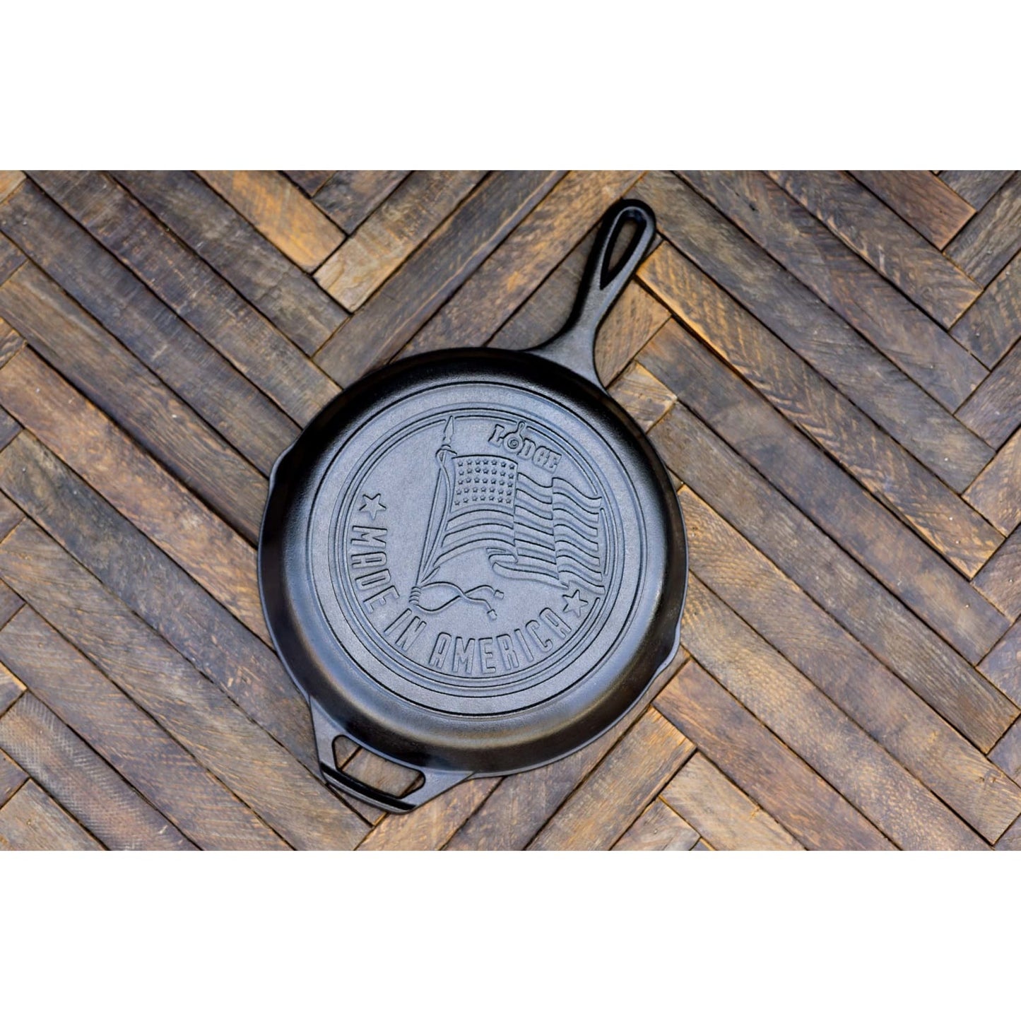 Handcrafted cast iron skillet with embossed American flag and "Made in America" text, featuring natural seasoning and superior heat retention, ideal for Kitchen & Food, Cookware, Cast Iron, USA Made, Best Sellers, and Promo Eligible collections.