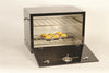 Black heat-resistant steel oven with two racks and front door open, containing muffins on a tray, handcrafted and Amish made, ideal for stoves and cookstoves collections in the USA Made category