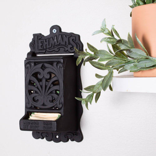 Handcrafted black vintage-style wall-mounted matchbox holder with decorative scrollwork, made in USA, perfect for Home & Decor, Household Helpers, and Best Sellers collections.