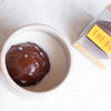 Handcrafted hot chocolate sphere with marshmallows inside a white ceramic mug, alongside clear packaging, perfect for Kitchen & Food, Snacks and Sweets, Beverages, USA Made, and Best Sellers collections.