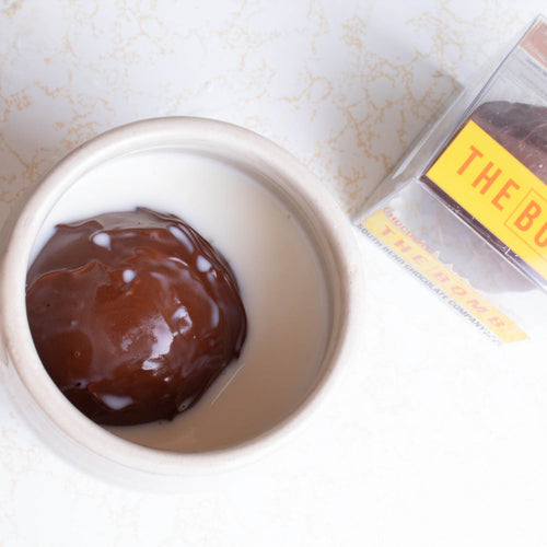 Handcrafted hot chocolate sphere with marshmallows inside a white ceramic mug, alongside clear packaging, perfect for Kitchen & Food, Snacks and Sweets, Beverages, USA Made, and Best Sellers collections.