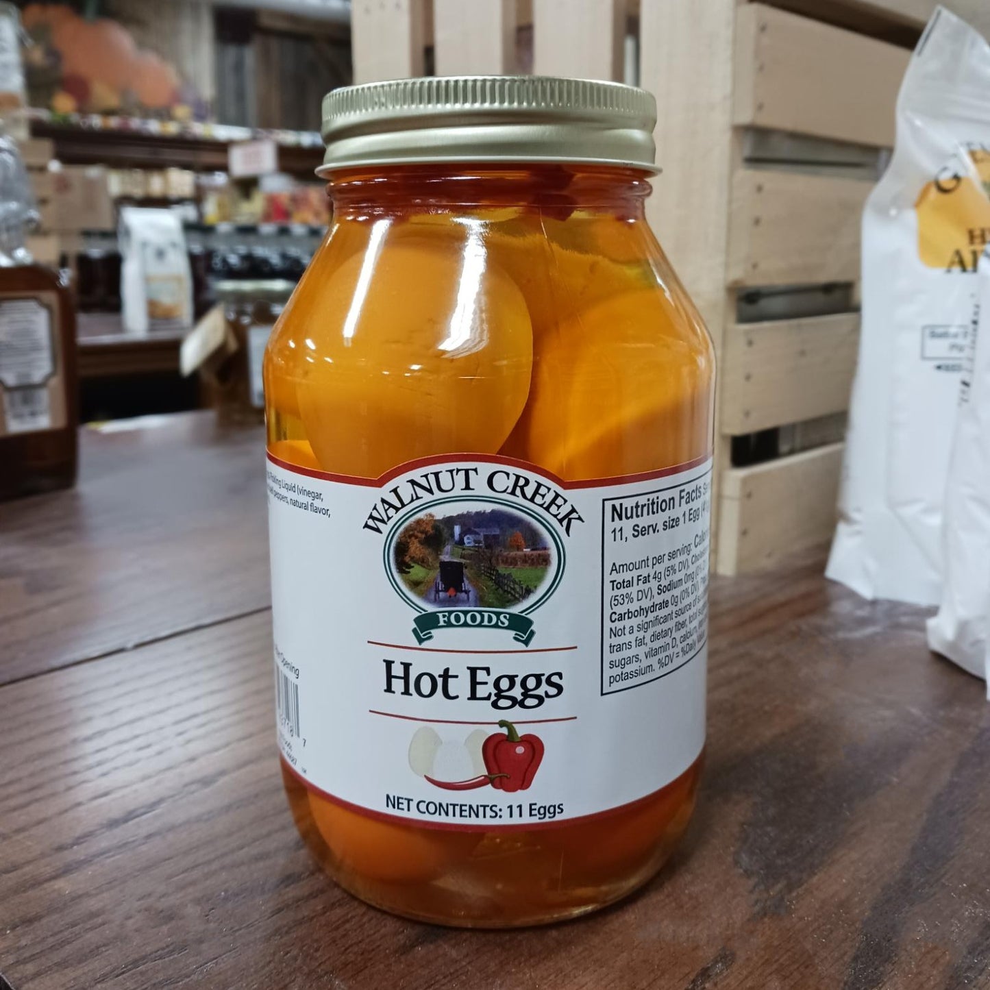 Glass jar of handcrafted hot eggs in spicy brine with metal lid and white label, locally made in USA, featured in Kitchen & Food, Food, Pantry, USA Made, Best Sellers, and Promo Eligible collections.