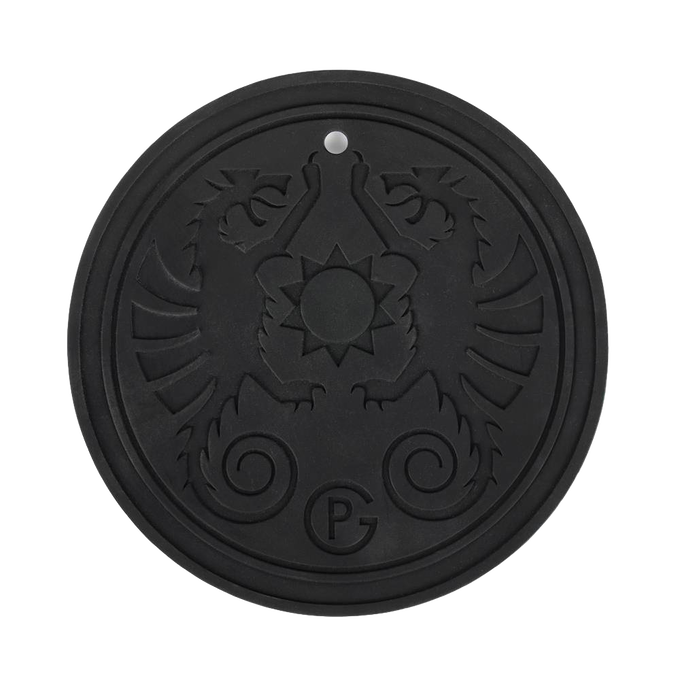 Black round silicone coaster with embossed twin griffin design and a central sun motif, temperature resistant and featuring a hanging eyelet, ideal for camping and lighting accessories.