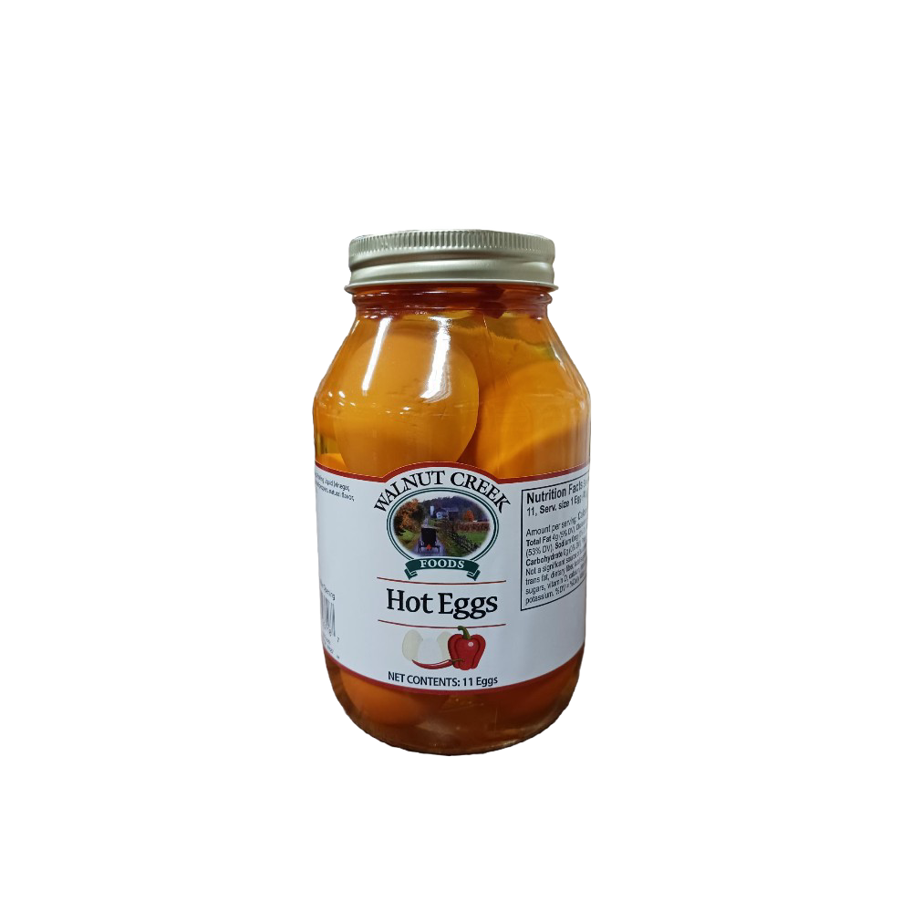 Glass jar of hot pickled eggs with a metal lid, featuring a white label and red pepper illustration, ideal for Kitchen & Food, Food, Pantry, USA Made, and Best Sellers collections.