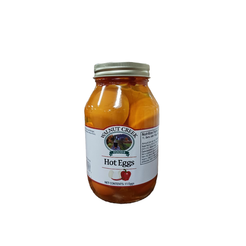Glass jar of hot pickled eggs with a metal lid, featuring a white label and red pepper illustration, ideal for Kitchen & Food, Food, Pantry, USA Made, and Best Sellers collections.