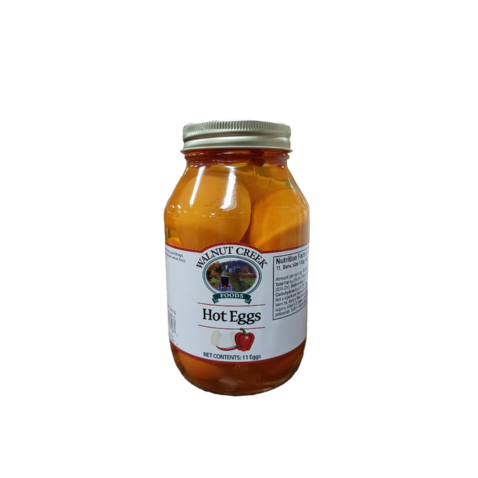 Glass jar of hot pickled eggs with a metal lid, featuring a white label and red pepper illustration, ideal for Kitchen & Food, Food, Pantry, USA Made, and Best Sellers collections.