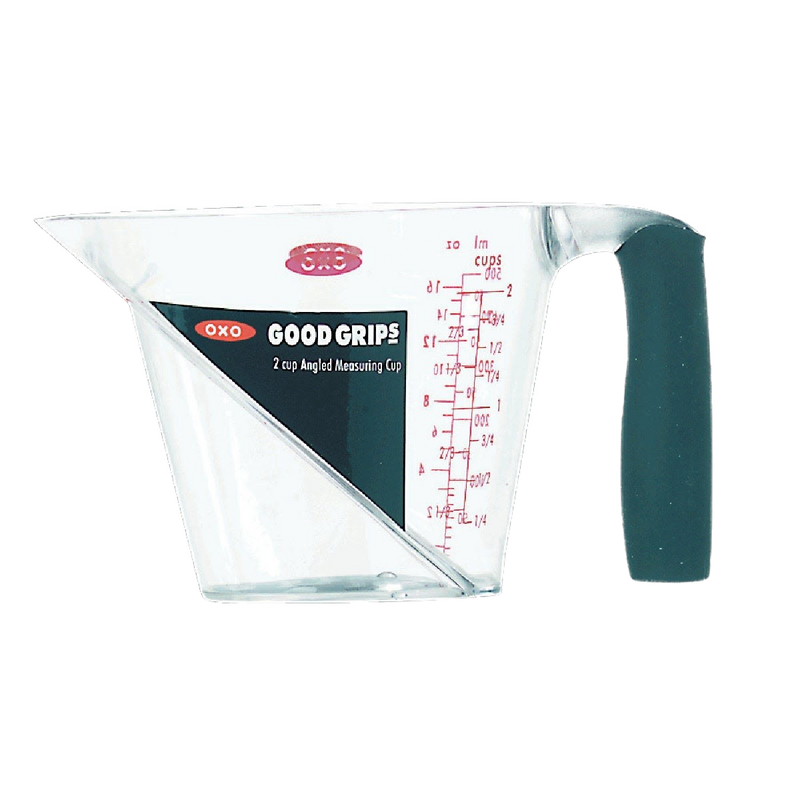 Clear plastic measuring cup with angled red measurement markings, textured black soft grip handle, designed for easy reading from above, featured in Kitchen & Food and Measuring collections.