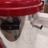 Close-up of a stainless steel milk pasteurizer with a red lid and side spout, designed for safe milk processing, featured in Farm, Garden & Tool and Animal Care collections.