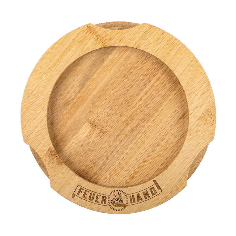 Handcrafted bamboo oil lantern coaster with engraved Feuerhand logo, featuring indentations for secure placement, designed to protect surfaces from oil stains, ideal for camping and emergency use.
