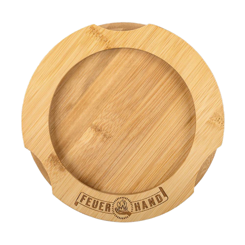 Handcrafted bamboo oil lantern coaster with engraved Feuerhand logo, featuring indentations for secure placement, designed to protect surfaces from oil stains, ideal for camping and emergency use.