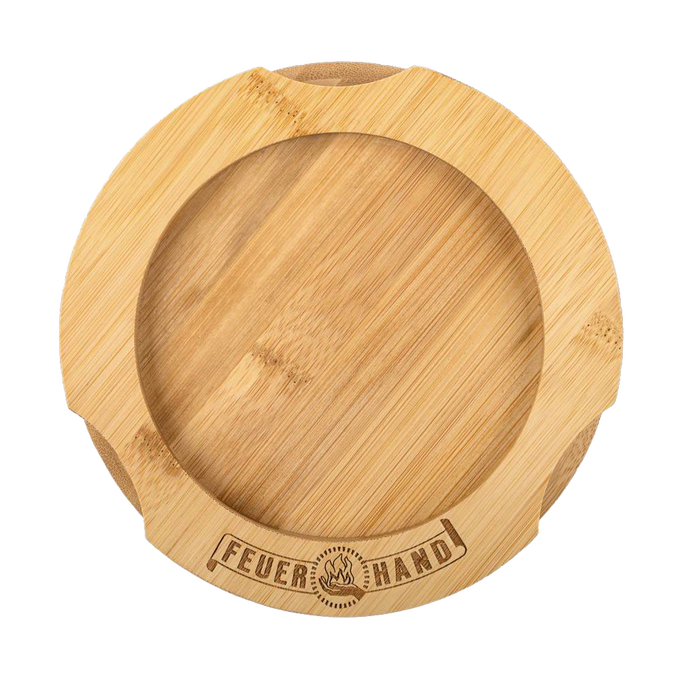 Handcrafted bamboo oil lantern coaster with engraved Feuerhand logo, featuring indentations for secure placement, designed to protect surfaces from oil stains, ideal for camping and emergency use.