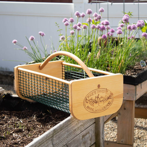Handcrafted garden hod with smooth wooden ends and curved handle, featuring green wire mesh sides and engraved logo, part of Farm, Garden & Tool, USA Made, and Best Sellers collections.