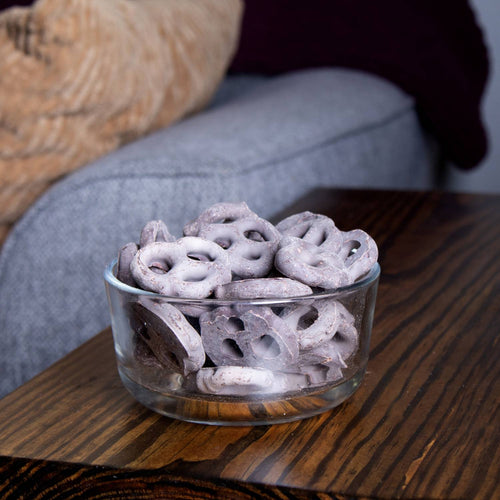 Clear glass bowl filled with Amish made handcrafted mini pretzels coated in white chocolate, a USA made snack perfect for Kitchen & Food, Snacks and Sweets, Candy, Best Sellers, and Promo Eligible collections.