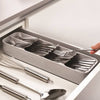 Compact cutlery organizer with angled compartments neatly storing forks, spoons, and knives in a kitchen drawer, paired with stainless steel utensils, featured in Kitchen & Food and Kitchen Gadgets collections.