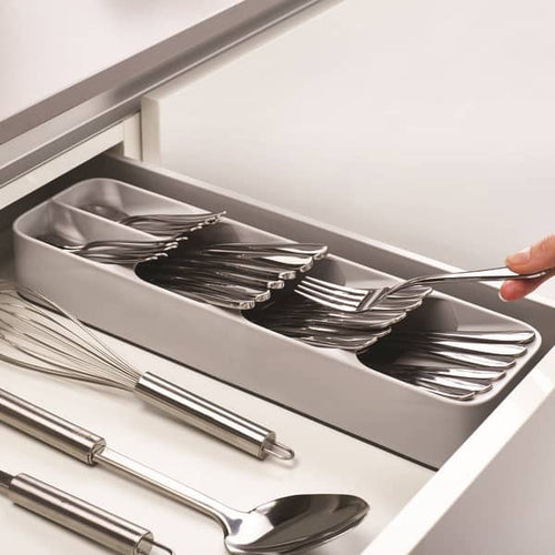 Compact cutlery organizer with angled compartments neatly storing forks, spoons, and knives in a kitchen drawer, paired with stainless steel utensils, featured in Kitchen & Food and Kitchen Gadgets collections.