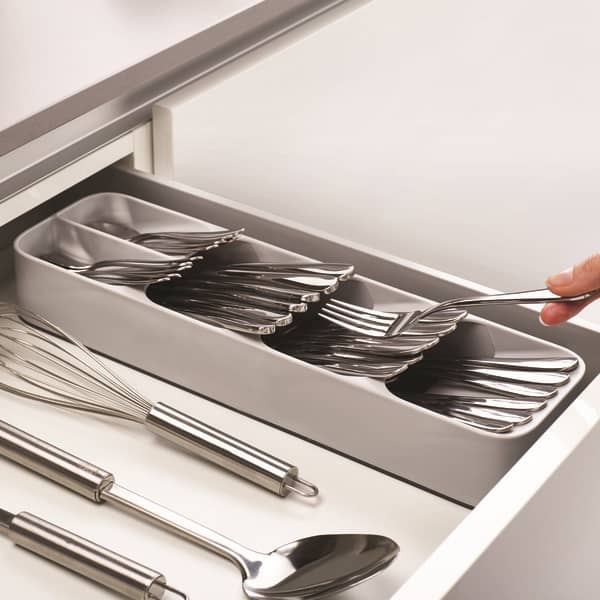 Compact cutlery organizer with angled compartments neatly storing forks, spoons, and knives in a kitchen drawer, paired with stainless steel utensils, featured in Kitchen & Food and Kitchen Gadgets collections.