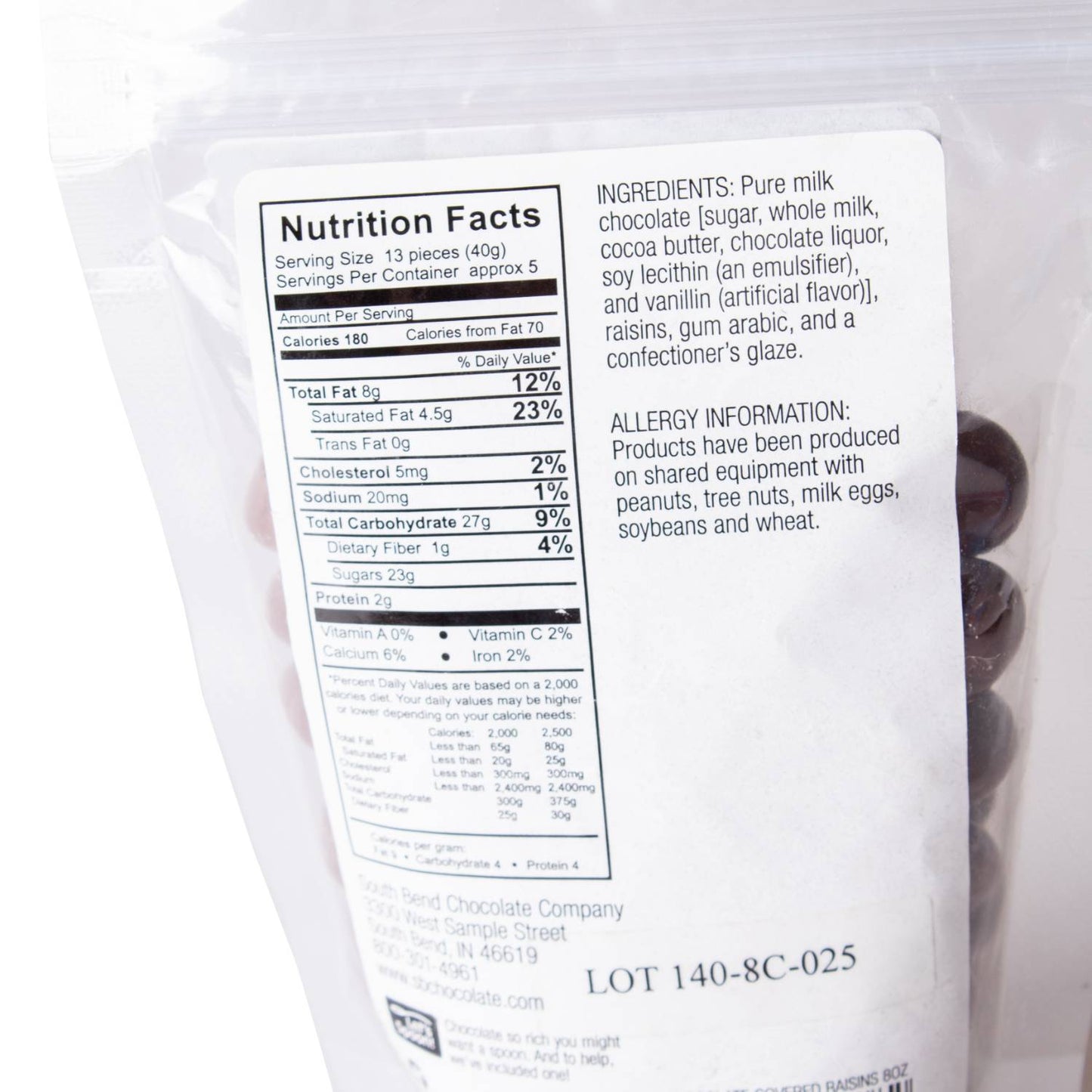 Back of a resealable bag showing nutrition facts, ingredient list, and allergy information for handcrafted milk chocolate covered raisins, made in USA, featured in Kitchen & Food, Snacks and Sweets, Candy, USA Made, Best Sellers, and Promo Eligible collections.