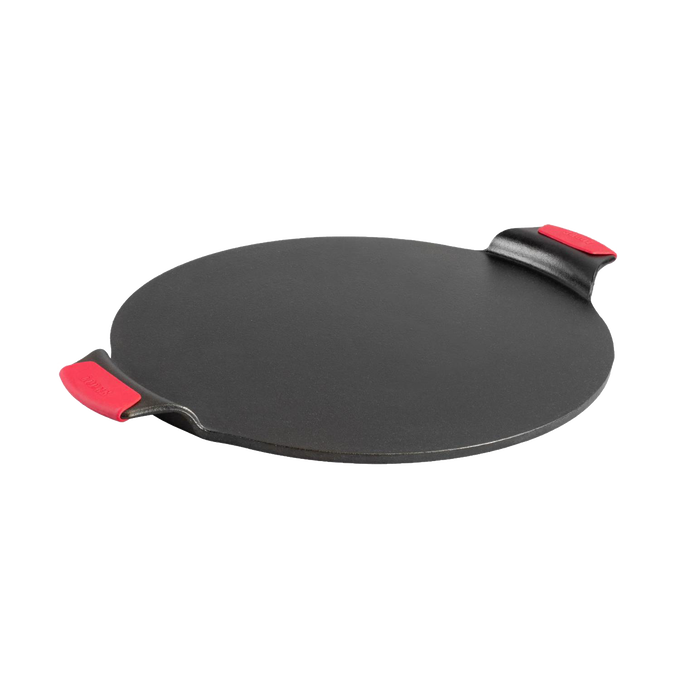 Seasoned cast iron pizza pan with dual handles featuring red silicone grips, designed for even heat and edge-to-edge baking, ideal for Kitchen & Food, Cookware, and USA Made collections.