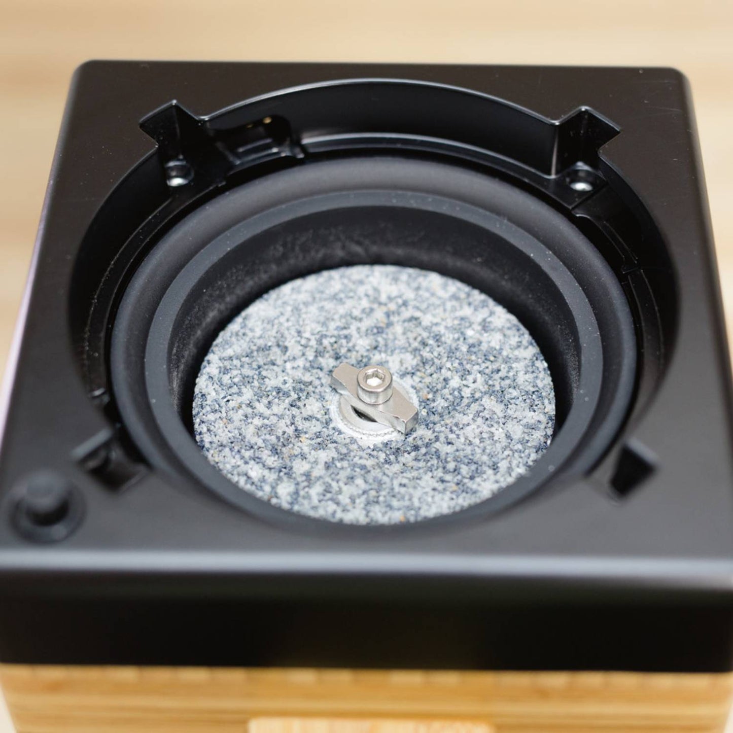 Close-up of the near diamond-hard corundum milling stone inside the NutriMill Harvest Electric Grain Mill, designed for versatile grinding in Kitchen & Food and Grain Mills collections.